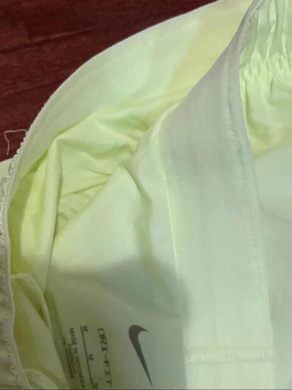 Nike men’s Pale Yellow Running Shorts with Reflective Swoosh nwt logo pockets